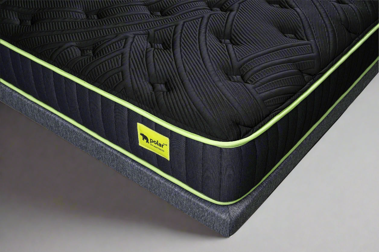 Black rv king mattress with green trim and a visible brand logo on a white background